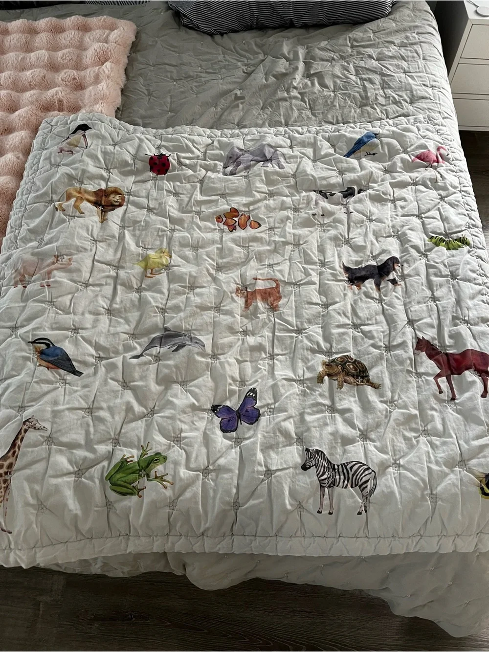 Lovevery organic comforter with animals and stripes
